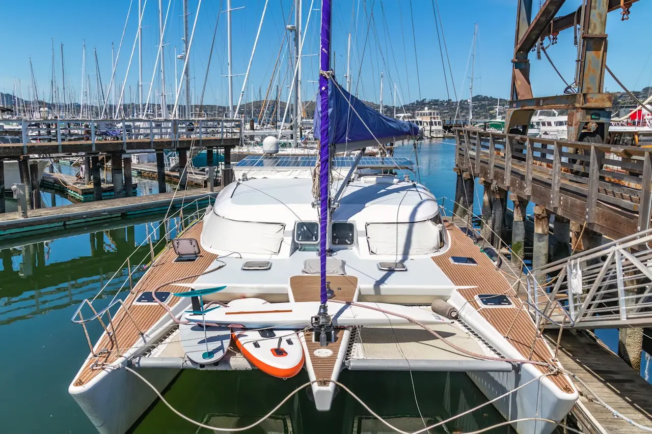 The catamaran is docked at the pier