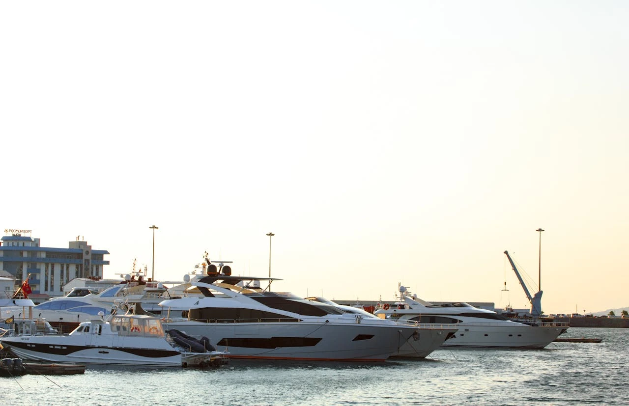 The yacht is docked on the shore